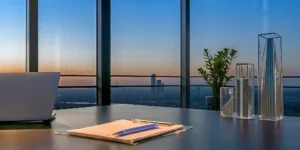 City skyline from an office where an accredited investor reviews the best real estate investment funds.